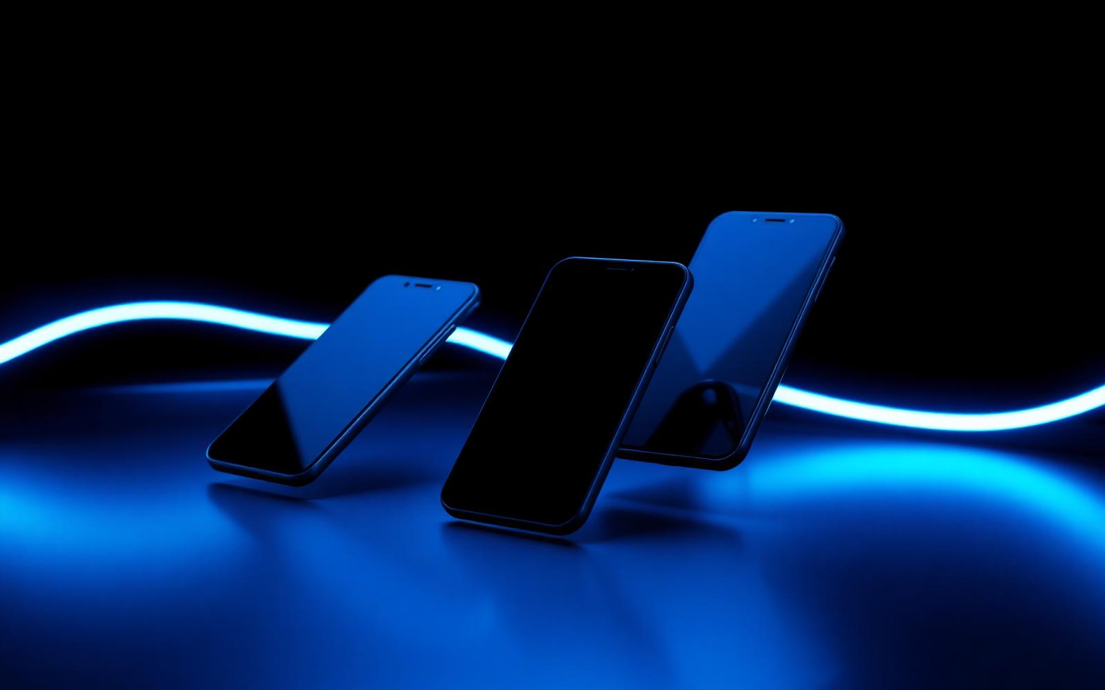 Smartphones modernos com iluminação azul neon